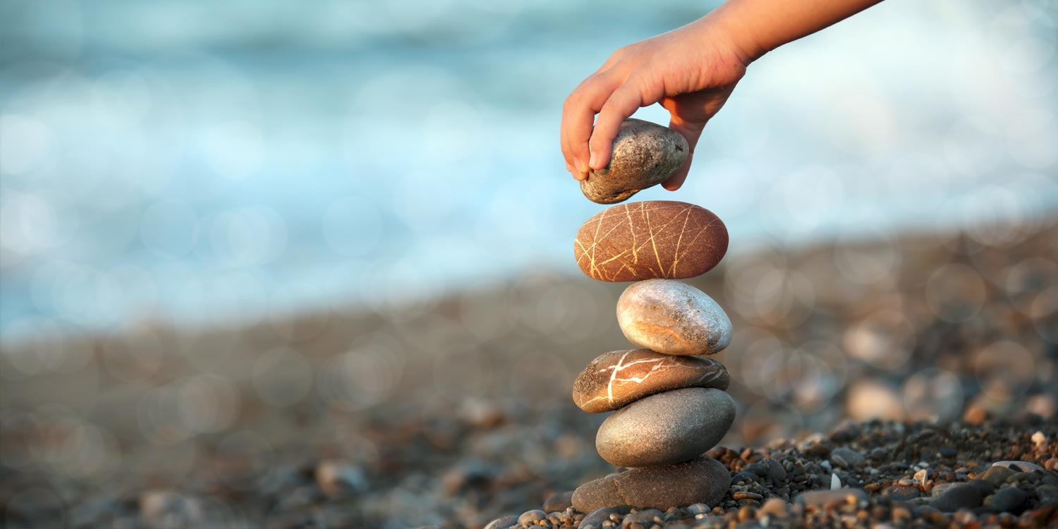 Stones being balanced on top of one another