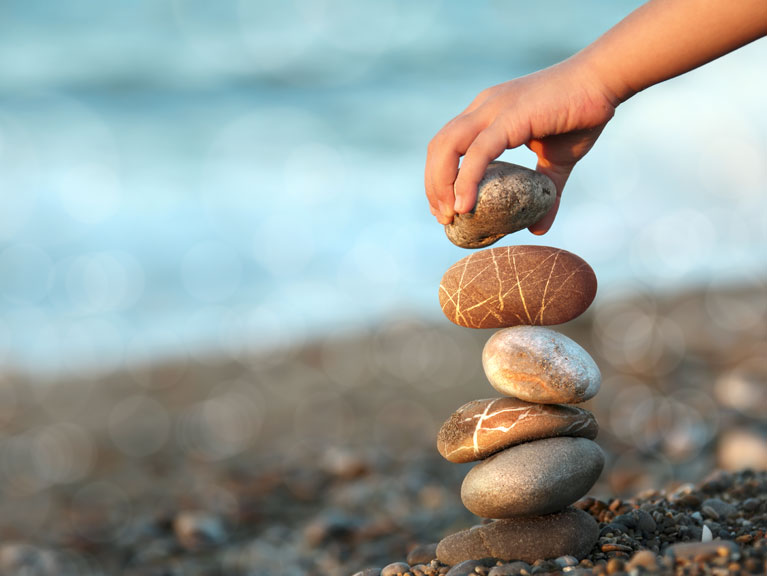 Stones being balanced on top of one another